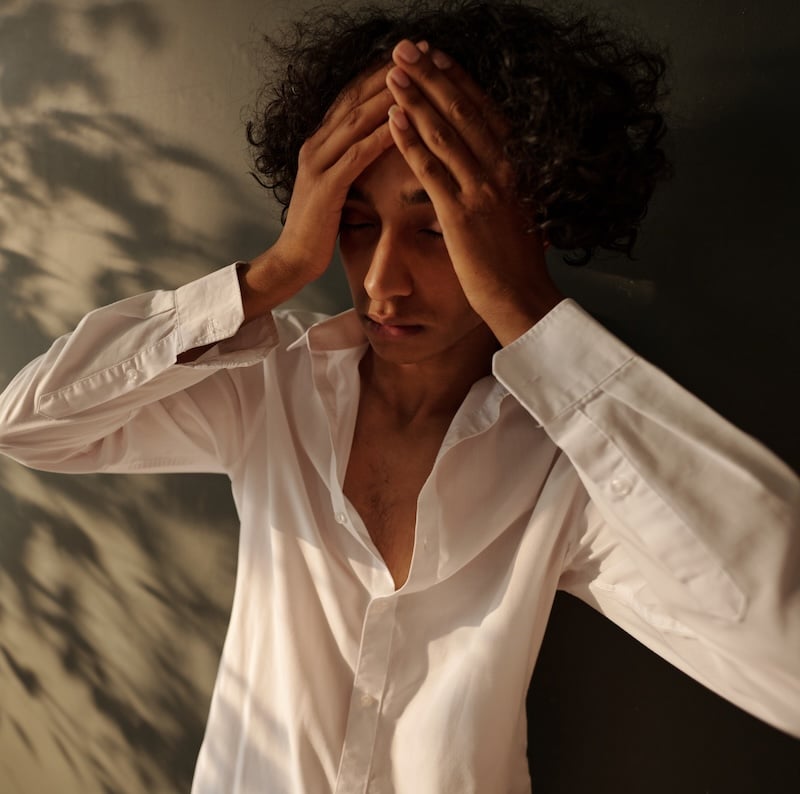 Drunk man with splitting headache Drunk man with splitting headache